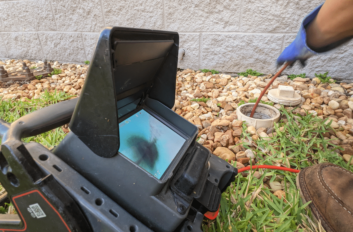 Drain service camera being used in pipe