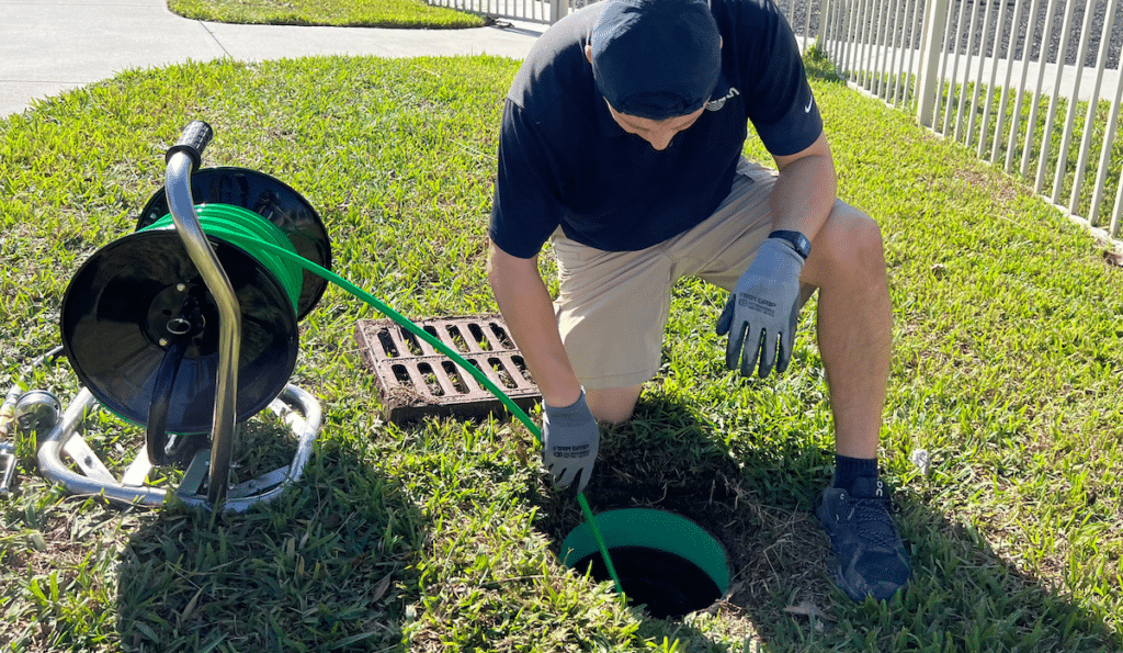 Sleuth Tech at open drain in back yard Kissimmee