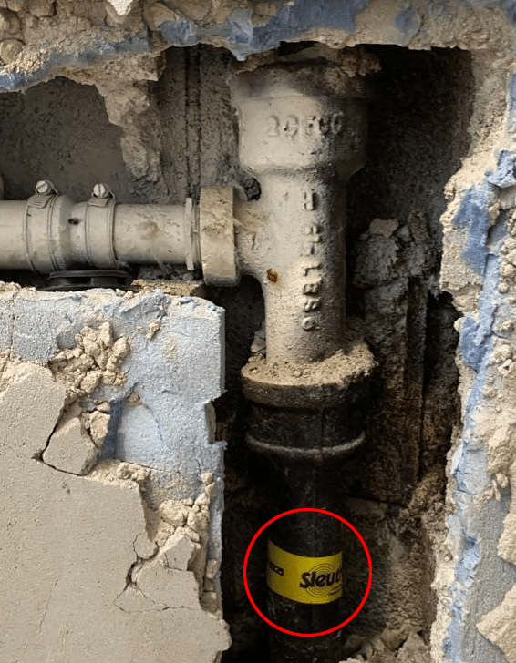 Exposed pipe with Sleuth Leak Detection tape