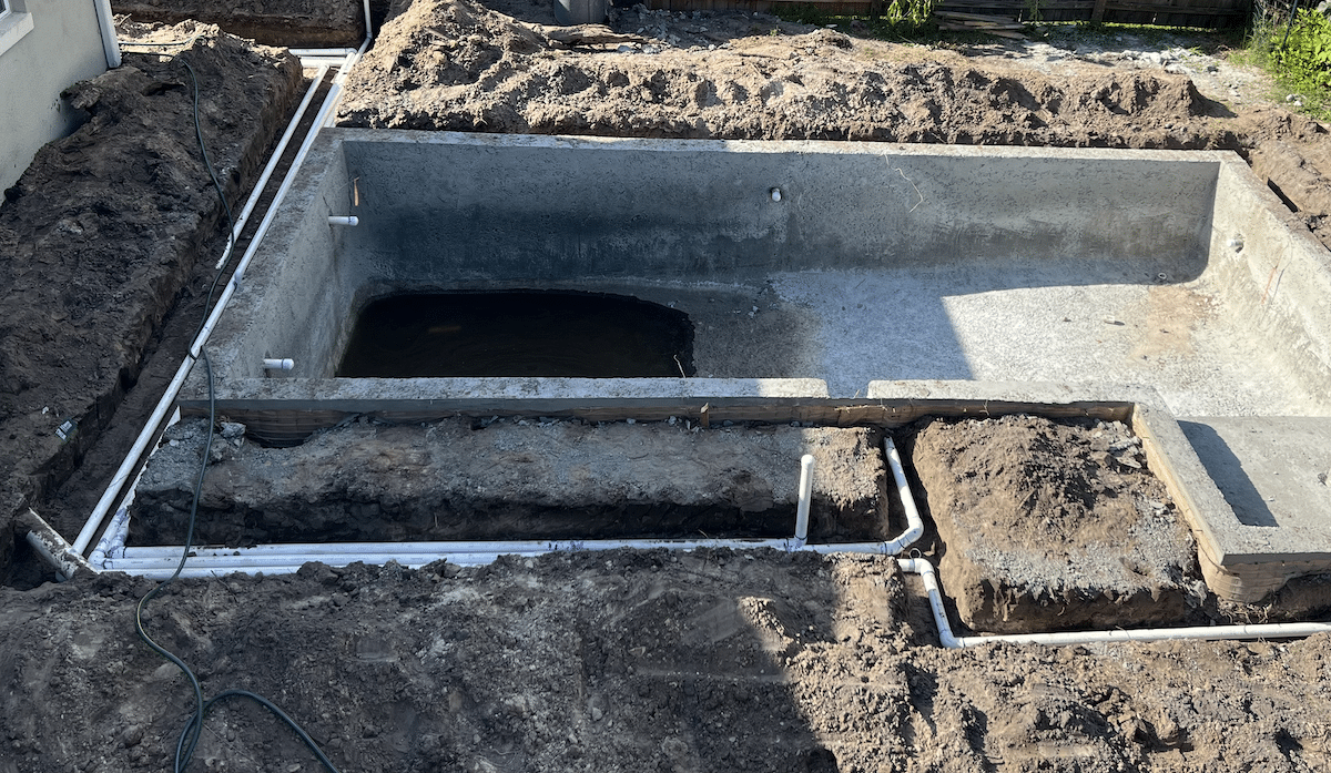 Pipes in ground around pool