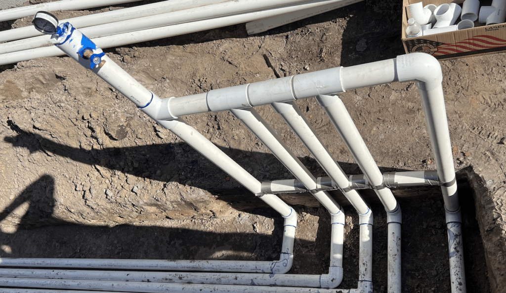 Pipes in ground around pool