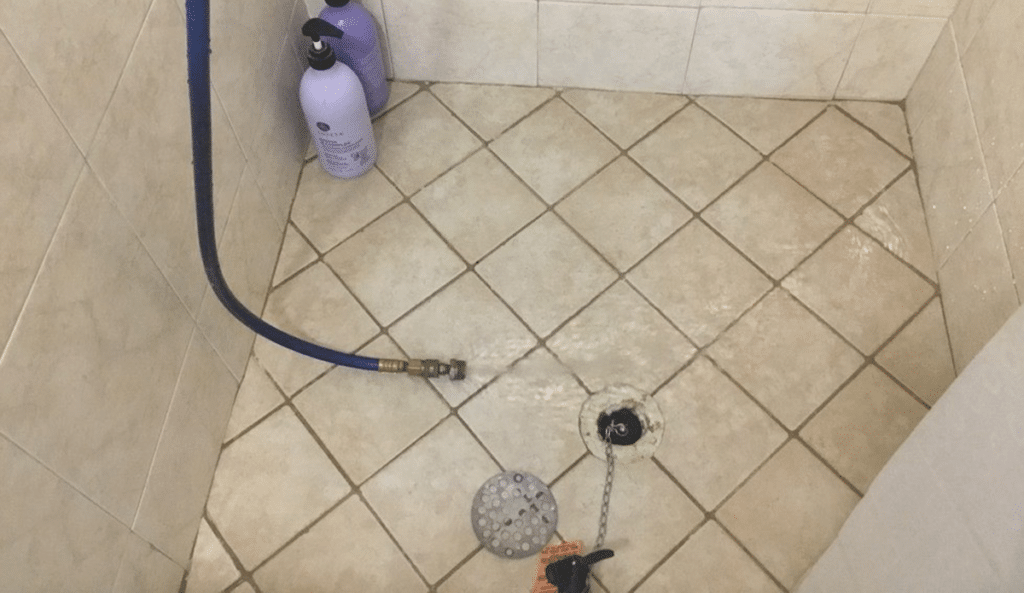 Image of pan testing in shower drain
